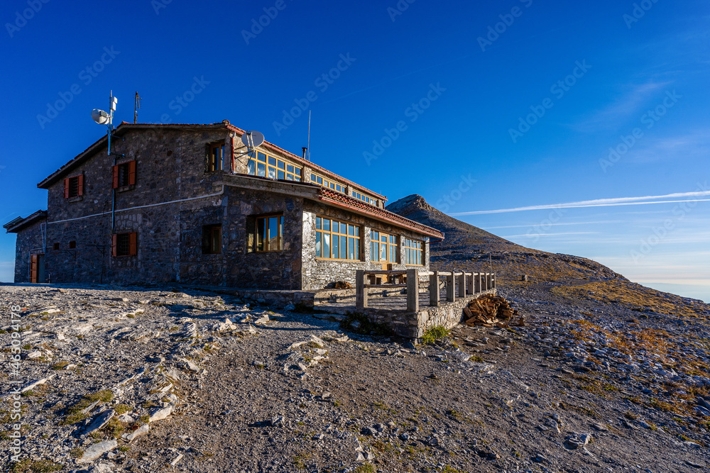 Refuge in the greek mountains made of stone with blue sky in the background