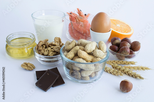 Close-up on food allergens on the white  background. Copy space. Food allergy concept. photo