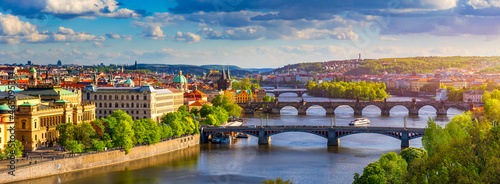 Scenic view of the Old Town pier architecture and Charles Bridge over Vltava river in Prague, Czech Republic. Prague iconic Charles Bridge (Karluv Most) and Old Town Bridge Tower at sunset, Czechia.