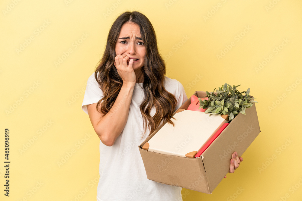 Young caucasian woman making a move isolated on yellow background biting fingernails, nervous and very anxious.