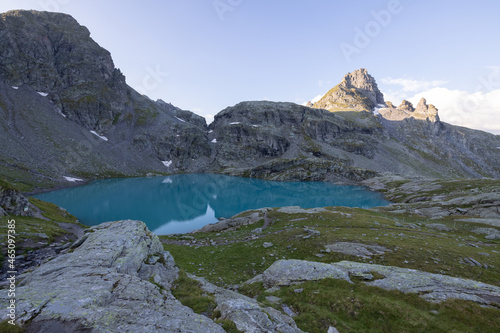 Wonderful view over a beautiful alpine lake in Switzerland called Schottensee. Epic sunrise over a perfect blue lake.