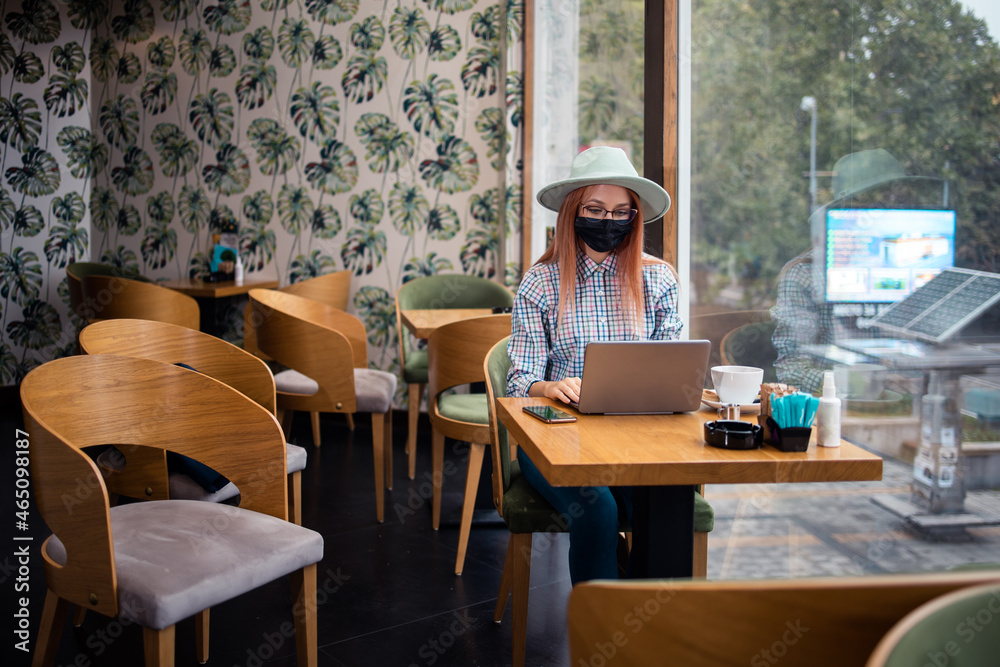 Portrait of young woman at caffe break.Work from home. Portrait of young woman at caffe break.Work from home.