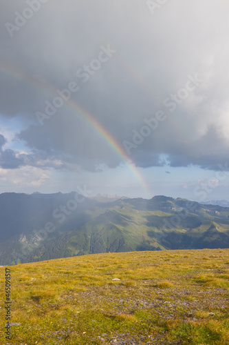 Amazing hiking day in one of the most beautiful area in Switzerland called Pizol in the canton of Saint Gallen. What a wonderful rainbow at the horizon. Beautiful colors. Epic view.