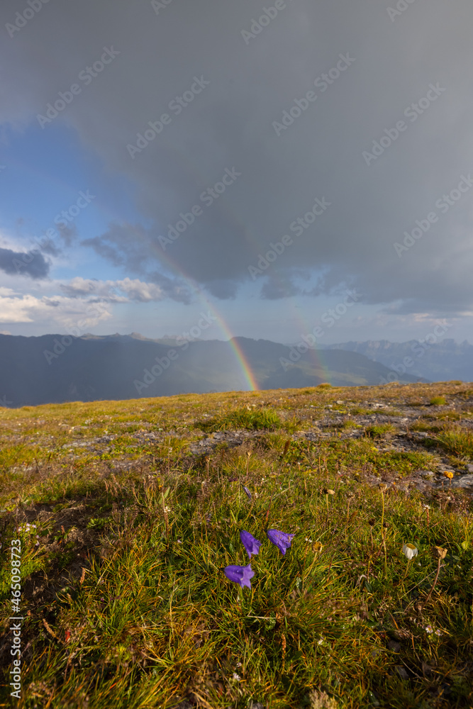 Amazing hiking day in one of the most beautiful area in Switzerland called Pizol in the canton of Saint Gallen. What a wonderful rainbow at the horizon. Beautiful colors. Epic view.