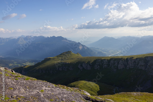 Amazing hiking day in one of the most beautiful area in Switzerland called Pizol in the canton of Saint Gallen. What a wonderful landscape in Switzerland at a sunny day. Beautiful blue alpine lake. photo