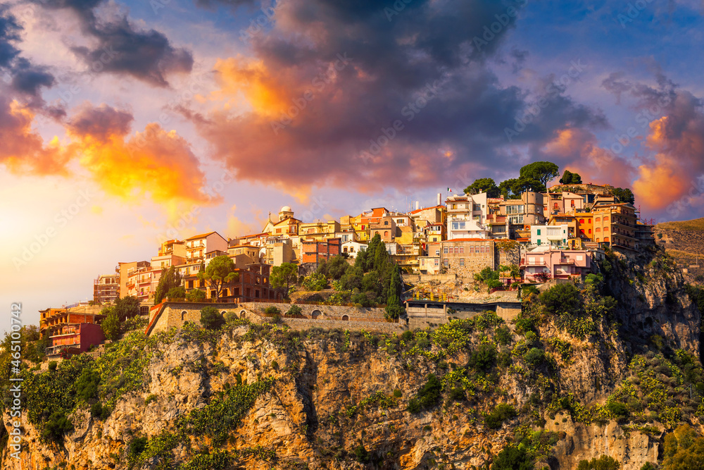 Castelmola: typical sicilian village perched on a mountain, close to Taormina. Messina province, Sicily, Italy. Castelmola town on rocky mountain top in Sicily, Italy.
