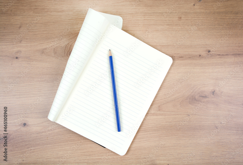 Empty notepad with pencil on wooden table Empty notepad with pencil on wooden table