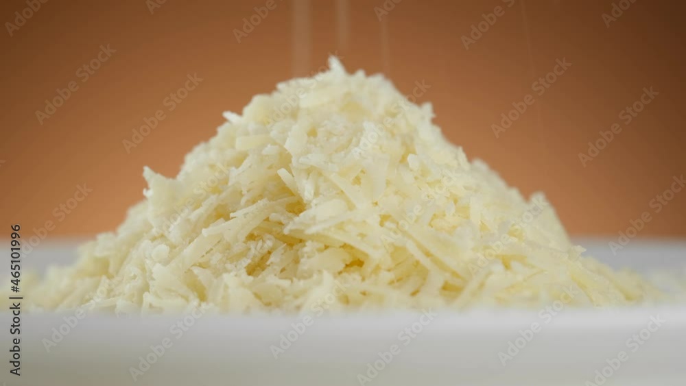 sprinkle grated parmesan cheese close-up. a man takes cheese in his hand and sprinkles it. 4K UHD video sprinkle grated parmesan cheese close-up. a man takes cheese in his hand and sprinkles it. 4K UHD video