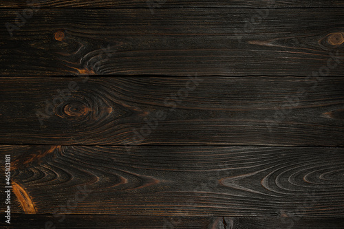 Dark brown wooden boards. Textured wooden background. Wallpaper