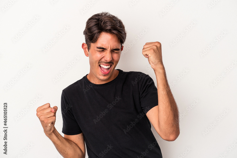 Young mixed race man isolated on white background dancing and having fun. Young mixed race man isolated on white background dancing and having fun.
