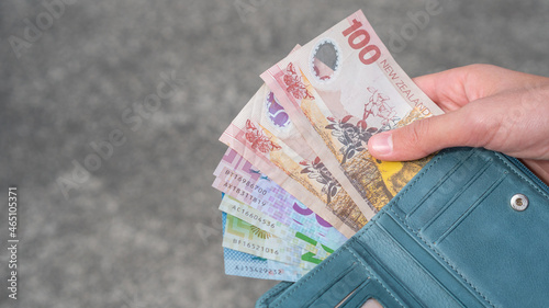 Bild auf Leinwand Payout Concept - Person Holding New Zealand Bank Notes hundreds, fifties, twenti