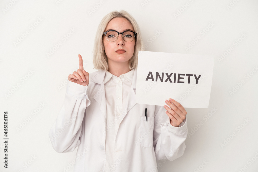 Young pharmacist woman holding pills and depression cardboard isolated on white background Young pharmacist woman holding pills and depression cardboard isolated on white background