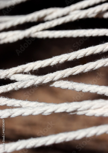 close-up white hammock ropes detail 