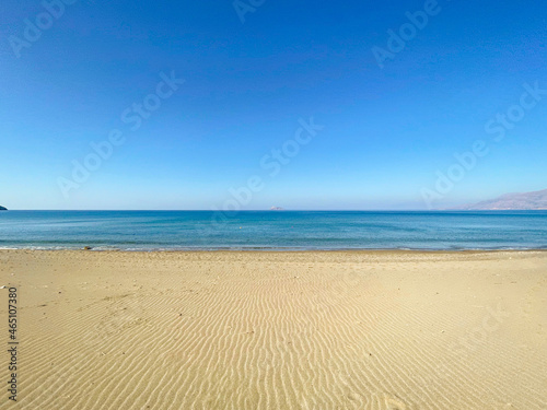 Sea like a mirror at the Komo beach in the south of Crete in Greece. With its golden sand stretches for more than four kilometers on the western edge of the fertile Messara plain