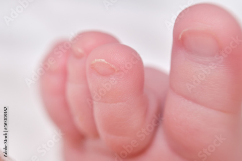 Toes on the foot of a newborn baby, close-up. Macro photo of a healthy toe of a child