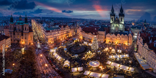 Panoramic view to the old town square of Prague with the famous Christmas Market and festive lights during a cold winter evening