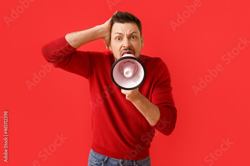 Protesting man with megapho...