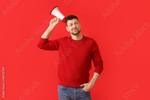 Thoughtful man with megapho...