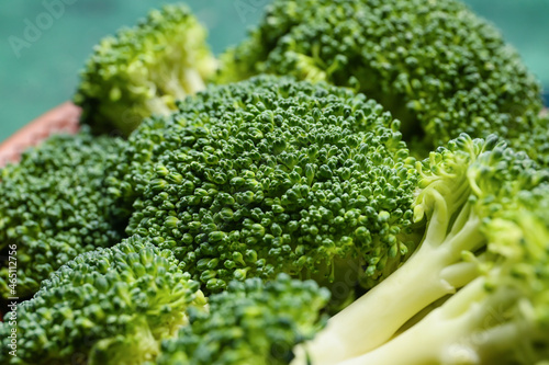Plate with healthy broccoli cabbage on color background, closeup