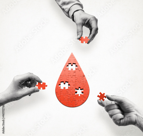 A puzzle in the form of a drop of blood. Blood donation. Concept. International Blood Donor Day.