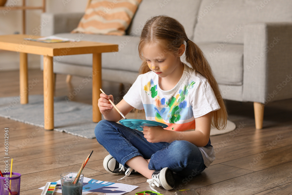 Little girl with brush and paint palette at home Little girl with brush and paint palette at home
