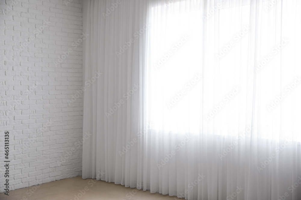 Light curtains on big window in empty room Light curtains on big window in empty room