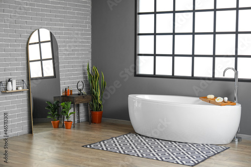 Interior of grey bathroom with mirror