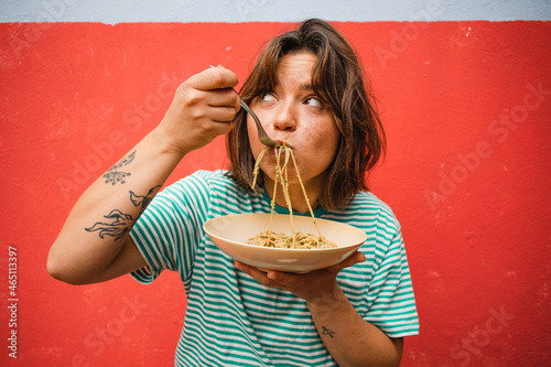 young woman eating pasta cute girl eating spaghetti having fun delicious food photography