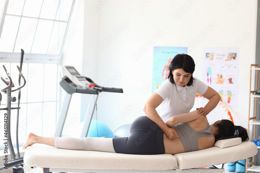 Young woman having therapy in rehabilitation center