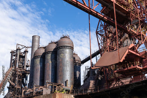 Abandoned steel mill, large blast furnaces and industrial structures for handling molten metal and supplies, horizontal aspect