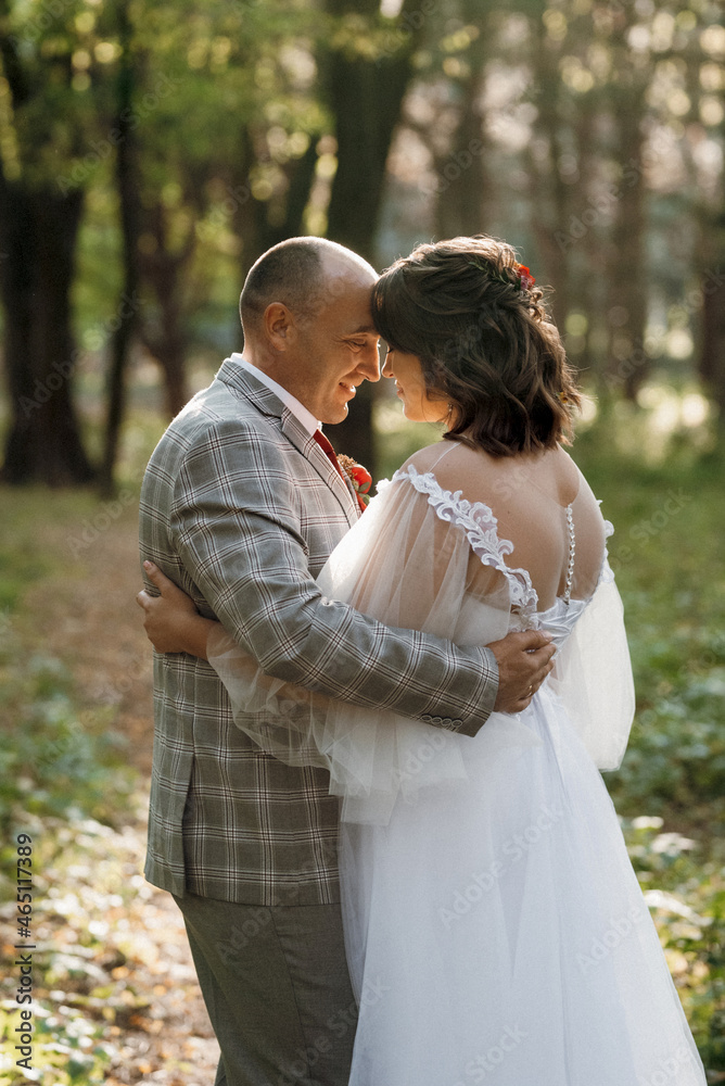 walk of the bride and groom through the autumn forest walk of the bride and groom through the autumn forest