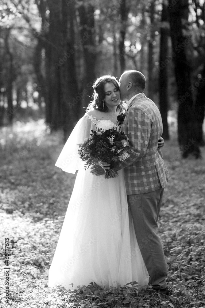 walk of the bride and groom through the autumn forest walk of the bride and groom through the autumn forest