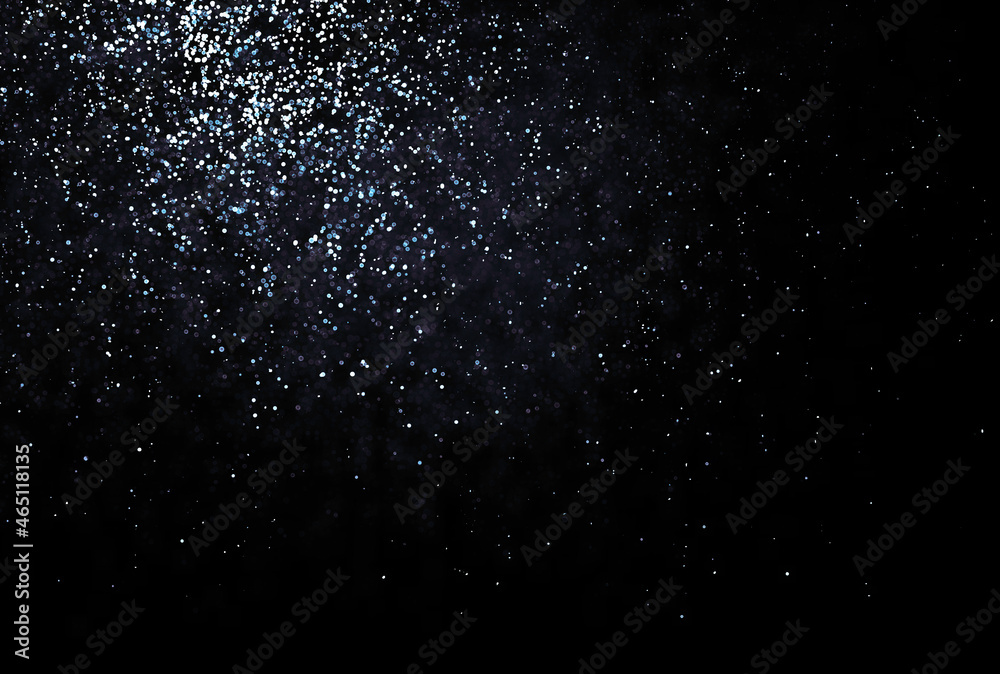 Shinny small particles glittering. Abstract texture on black background.