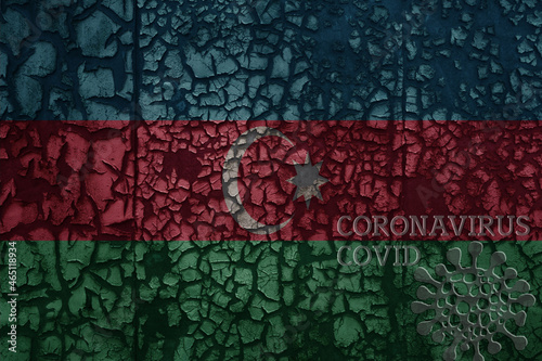 flag of azerbaijan on a old metal rusty cracked wall with text coronavirus, covid, and virus picture.