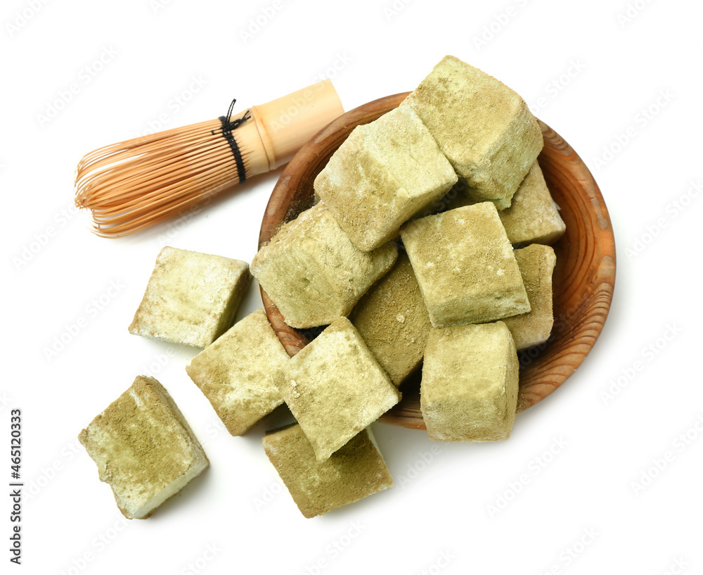 Fototapeta premium Bowl with tasty hojicha marshmallows and chasen on white background