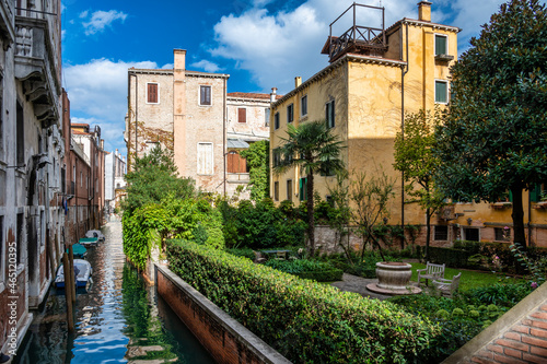 One of Venice's canals with the typical buildings in beautiful warm colors