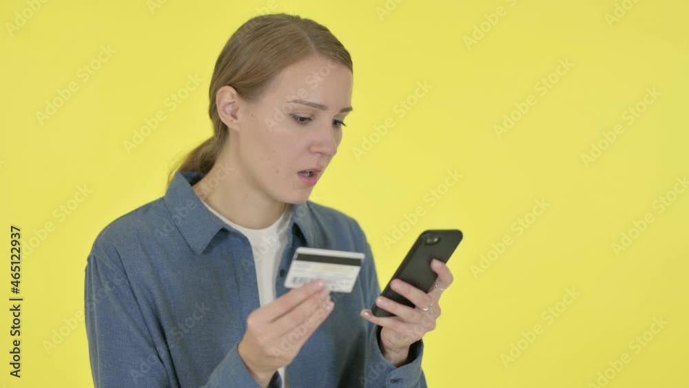 Online Shopping Failure on Smartphone by Woman on Yellow Background Online Shopping Failure on Smartphone by Woman on Yellow Background