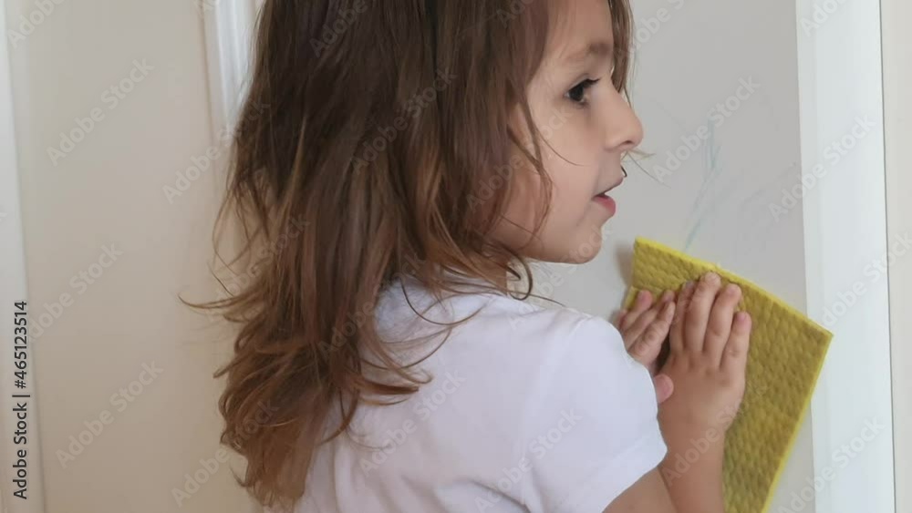 the child help to washes the wardrobe from the drawing with a pencil. Artistic noise picture the child help to washes the wardrobe from the drawing with a pencil. Artistic noise picture