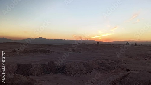 Beautiful time lapse of sunrise over the desert with observatory, military base. Egypt