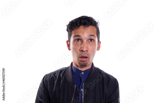 Man with idiot face isolated on white background. Young adult making silly face. Stupid face theater.