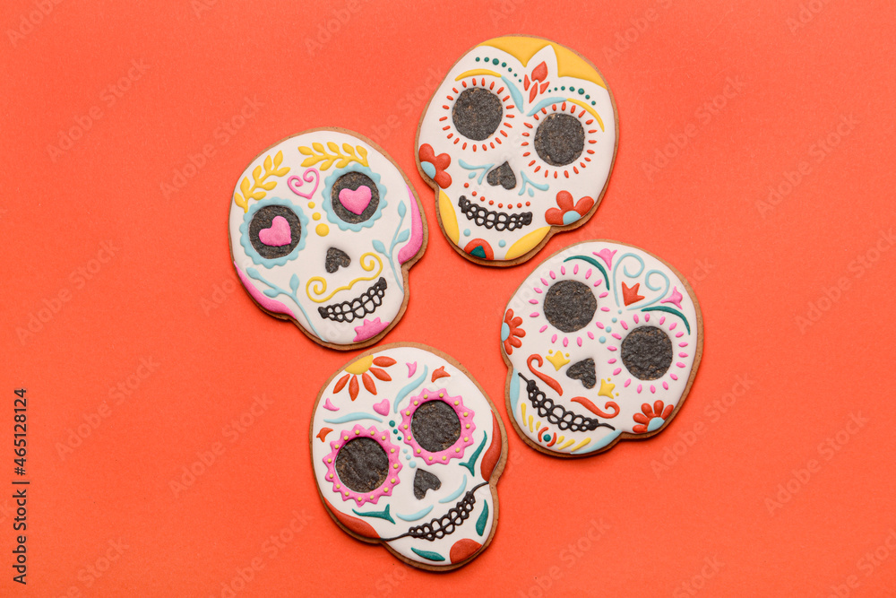 Skull shaped cookies on red background. El Dia de Muertos