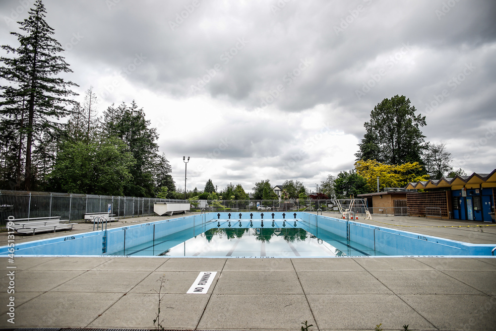 outdoor swimming pool under a cloudy sky