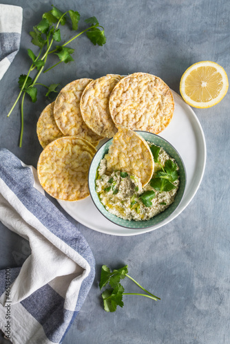 healthy dip with corn crackers. corianders and lemons photo