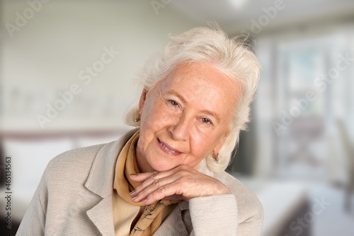 Smiling happy attractive mature woman, old lady looking at camera