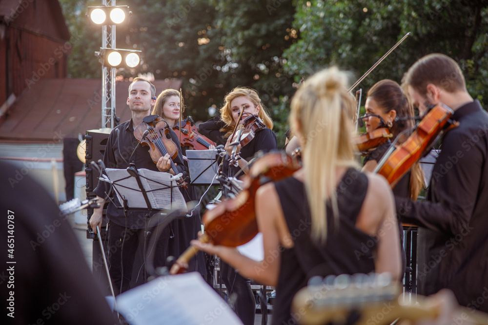 Orchestra having concert rehearsal on the street