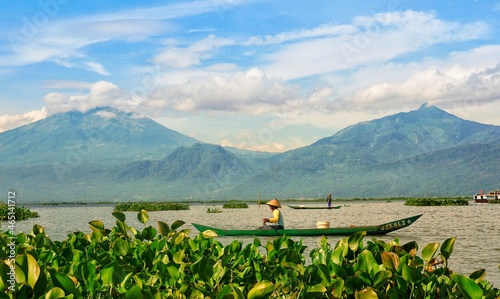 Fisherman in rawapening lake with mountain view background