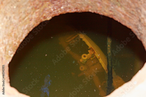 Flooded disguised secret military bunker. Abandoned bomb shelter photo