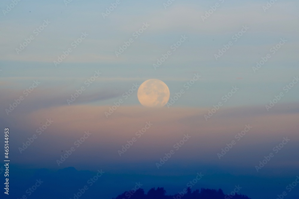 full moon over the clouds