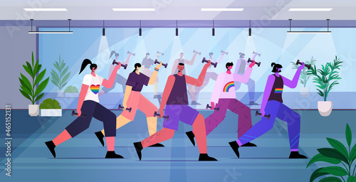 people doing stretching exercises LGBT parade pride festival transgender love concept fitness studio interior