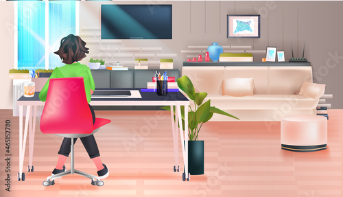 business woman freelancer or student sitting at workplace living room interior